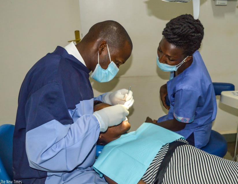 Dentists treat a patient. (File)
