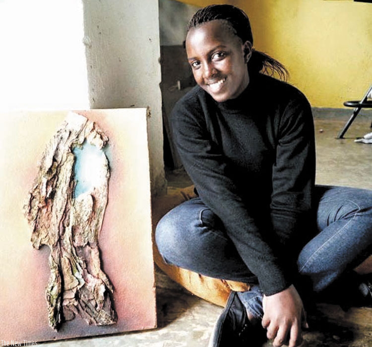Hortance Kamikazi with one of her art paintings. (Joseph Oindo)