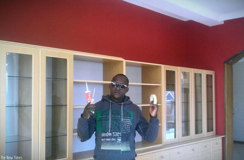 The artist showcases off some of his art tools. (Joseph Oindo)