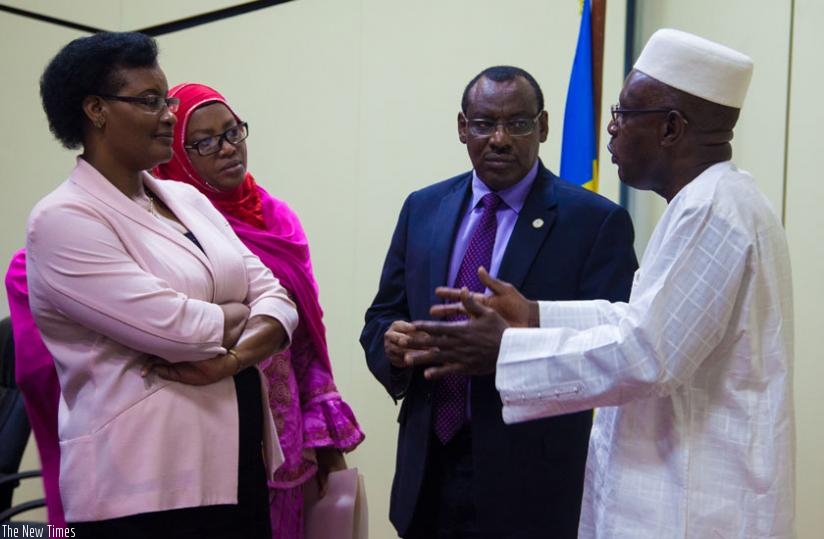 Minister Gatete (2nd right) chats with Speaker of the Chamber of Deputies Donatille Mukabalisa (L), and her deputy Abbas Mukama (R), and Senate vice-president Fatou Harerimana at P....