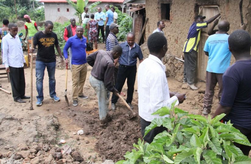Members of the citizen forum in Musanze District renovate house for a vulnerable resident. (Courtesy)