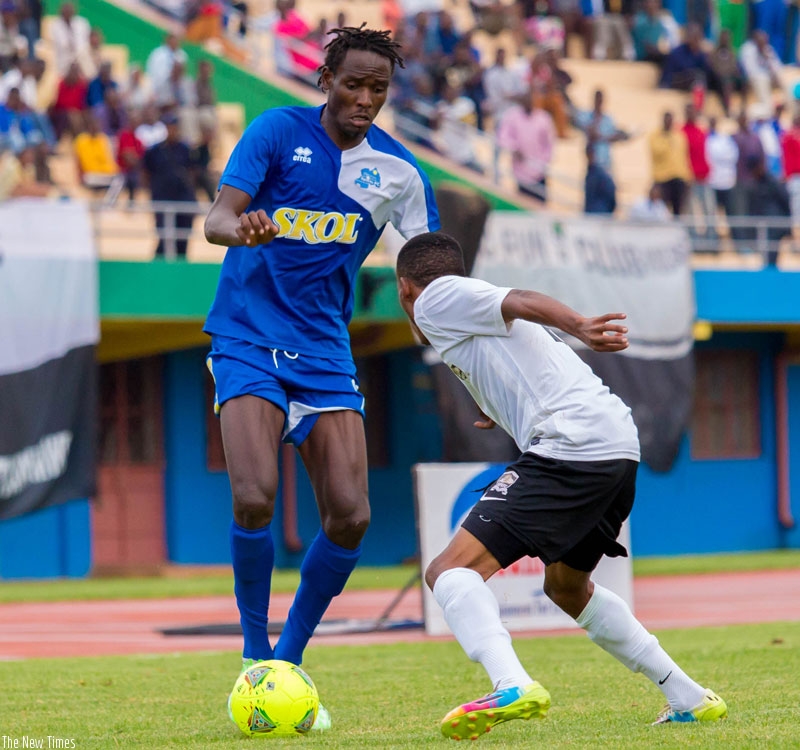 Rayon Sports striker Davis Kasirye tries to go past APR's left-back Eric Rutanga in the first round fixture that ended goalless. (File)