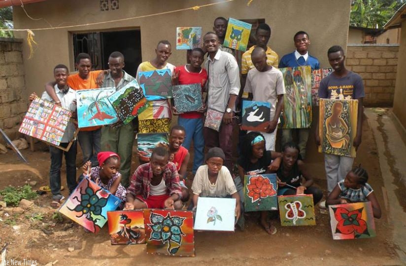 Aspiring artists show off their finished paintings.  (Courtesy)