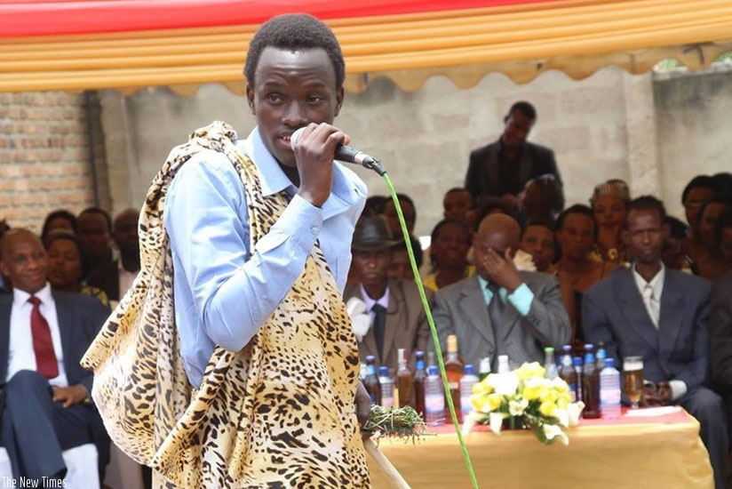 Tuyisenge recites one of his poems at a recent function. (Moses Opobo)