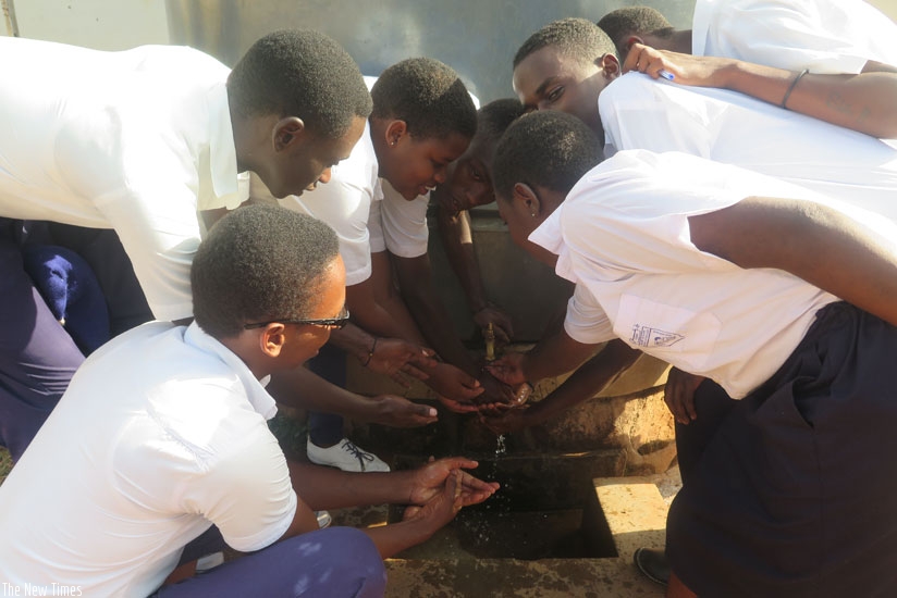 Students wash their hands. Proper hand hygiene before eating food is very crucial. (Solomon Asaba)