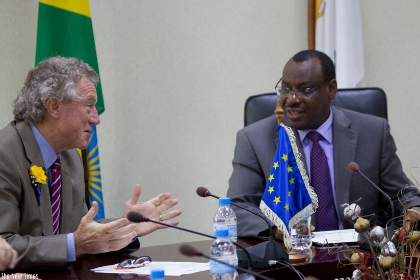 The Head of the European Union Delegation to Rwanda, Amb. Michael Ryan (L), chats with Finance and Economic Planning minister Claver Gatete after signing a financing agreement wort....