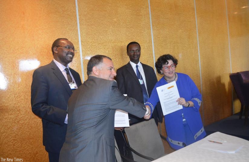 Arancha Gonzalez, the Executive Director, ITC  exchanges  documents with Stefano Arganese , the  Chief Executive Officer, DHL Freight - Central, Eastern, Southern Europe, America, ....