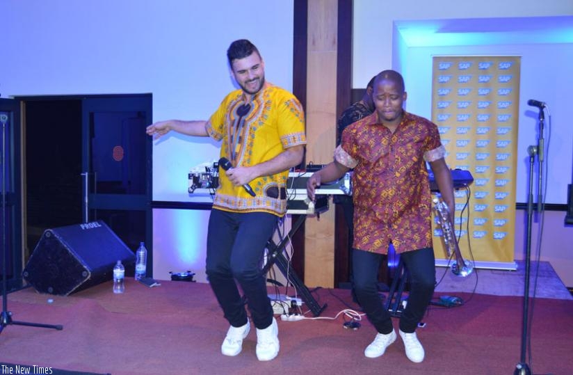 (L-R) J' Something and Mo-T pull dance moves during their performance at Serena.