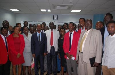 CMA's Bundugu (fourth left) and Sabuni (centre) pose for a picture with other South Sudanese officials and market dealers at the local bourse trading floor. The officials praised t....
