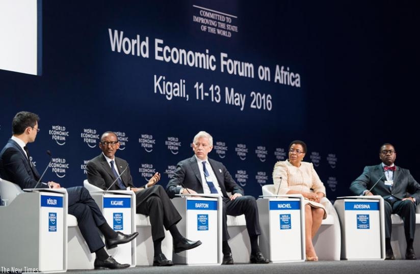 President Kagame together with World Economic Forum managing director Philipp Rosler ; Dominic Barton, Global Managing Director, McKinsey & Company; Graca Machel, Founder, Foundati....