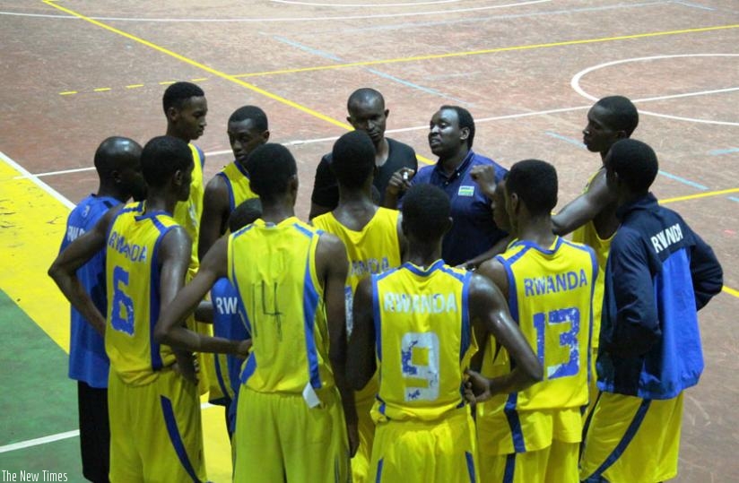 Head coach Moise Mutokambali gives instructions to his players in a league match against Espoir last week. The team leaves for the US on Sunday for a series of friendly games. (Peter Kamasa)
