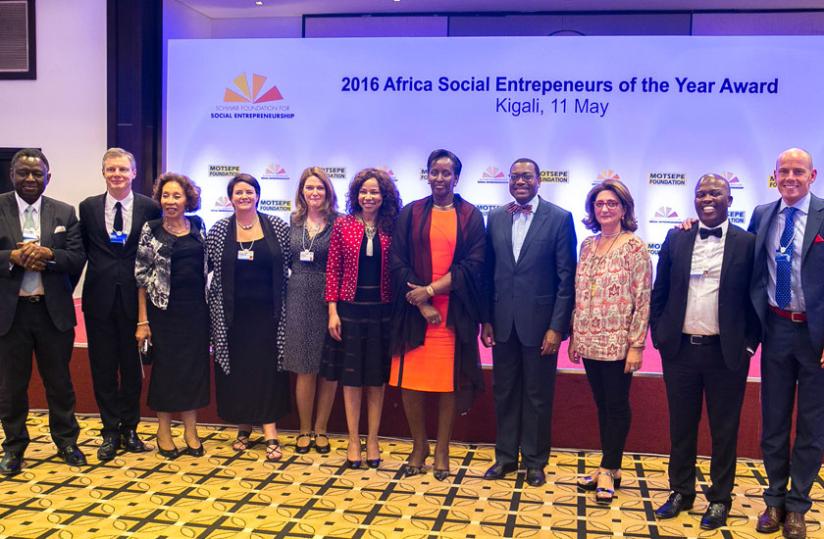 The First Lady poses with Dr Motsepe (to her right), Dr Akinwumi Adesina (to her left), Dr Babatunde Osotimehin (first left), Adrian Monck (second left), Dr Motsepe-Ramaphosa (thir....