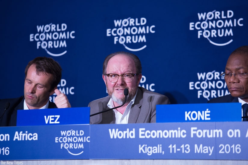 Vez (C) speaks at the WEF session on cybercrime in Kigali on Wednesday as Hall (L) and Konu00e9  look on. (Timothy Kisambirai)