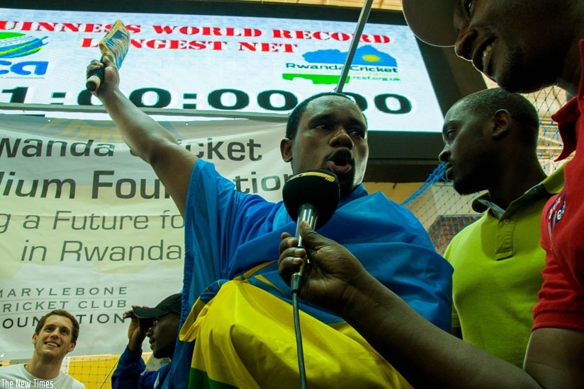 A victorious Eric Dusingizimana speaks to media after setting a new world record for the longest batting in the net. (Teddy Kamanzi)