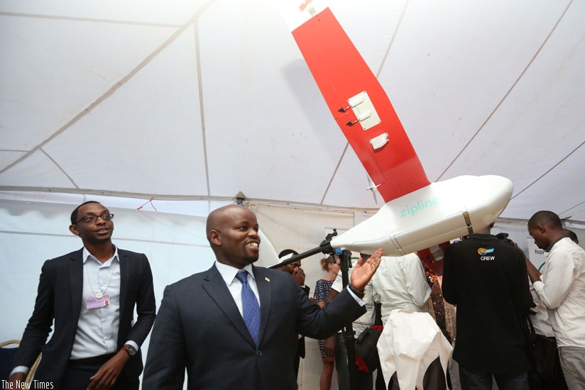Minister for ICT Jean-Philbert Nsengimana with one of the drone prototypes. (Julius Bizimungu)