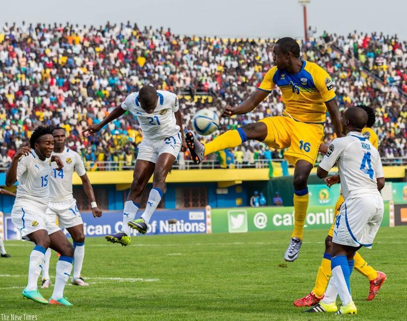 Ernest Sugira (#16) jumps to control the ball against Gabon during CHAN 2016 earlier this year. The striker is close to joining DR Congo's AS Vita Club. (File)