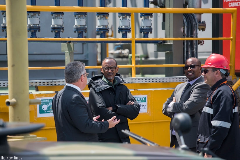 President Kagame, the Chief Executive of ContourGlobal Joseph Brant (L) and Minister James Musoni (2nd R) are given a tour of KivuWatt Methane Gas Power Plant on Lake Kivu in Karongi District yesterday. (Village Urugwiro)