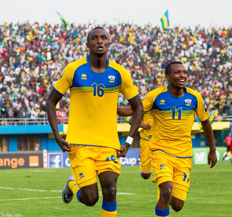 Ernest Sugira  (L) celebrates after scoring a goal during CHAN. The striker put pen to paper in a Rwf 102m deal with Vita Club on wednesday. rn(T. Kisambira)