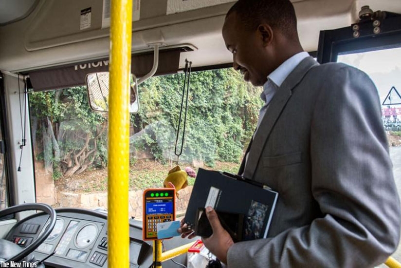 Emmanuel Asaba Katabarwa, the Rwanda Utilities Regulatory Agency head of transport department launches an e-ticketing service provided by AC Group in February.  This service is part of Smart Kigali initiative. (File)
