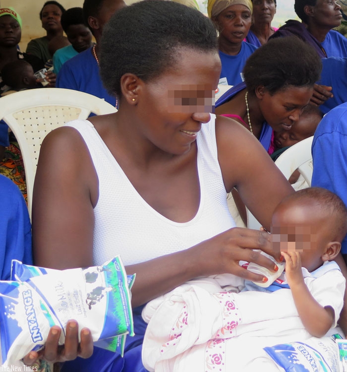 Niyonizeye gives her child milk. She has learnt how to love her child a gain after receiving treatment for postpartum depression. (Lydia Atieno)