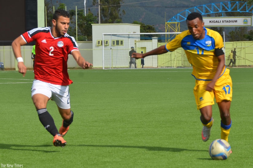 Skipper Dominique Savio Nshuti  tries to go past an Egyptian defender during the Afcon first leg tie in Kigali. (Sam Ngendahimana)