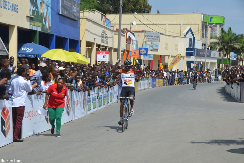 Les Amis Sportif rider, Joseph Areruya cerebrates after crossing the finish line in Rubavu. rn(Sam Ngendahimana)