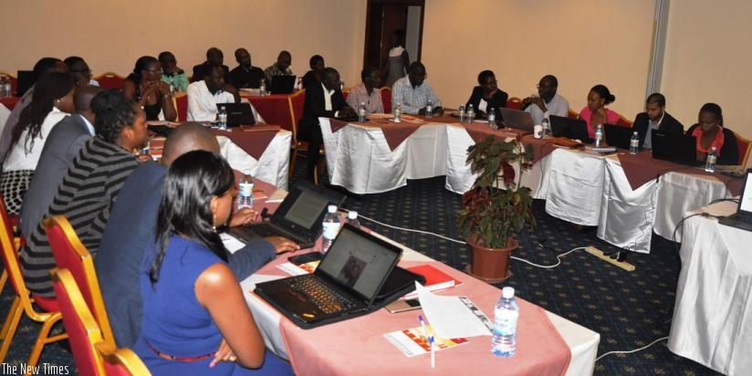 A cross-section of the participants who attended the regional meeting in Kampala listen to presentations. Businesses and experts called on regional governments to promote policies that benefit EAC citizens. (Julius Bizimungu)
