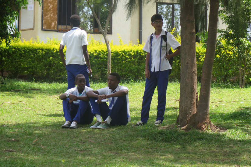 Students relax in a school compound. Peer pressure could drive students into drug abuse. (Solomon Asaba)