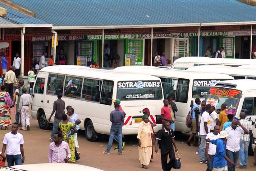 Passengers seek to board buses in Nyabugogo Park. Some of the buses belong to SOTRA. (File)