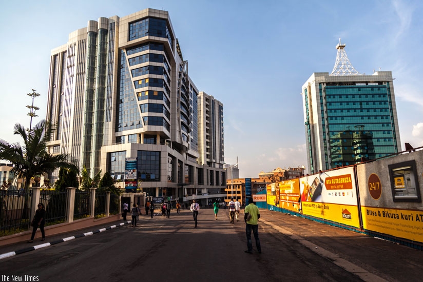 Pedestrans walk through the Car-Free Zone in Kigali. The idea was initially criticised but city dwellers have since warmed up to it. (T. Kisambira)