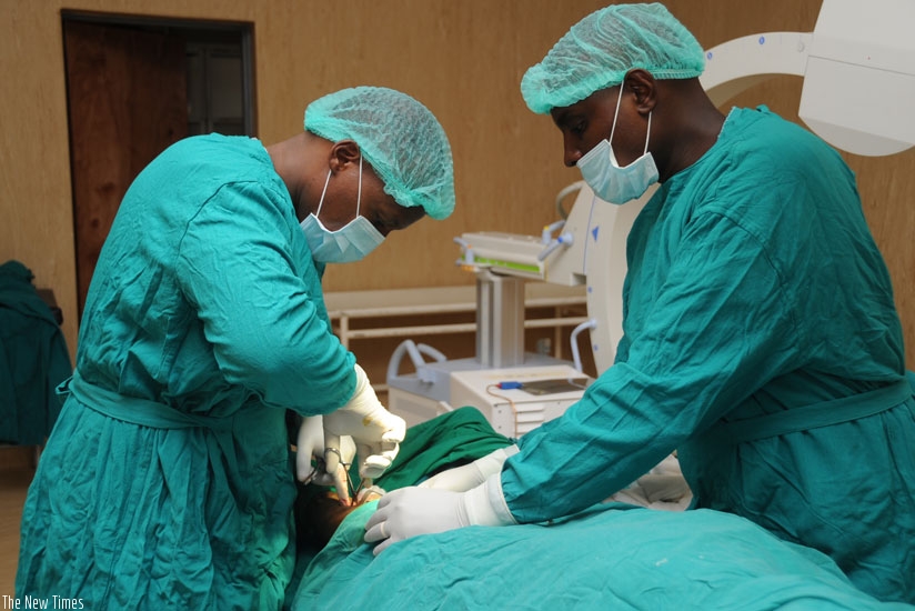Doctors at the Rwanda Military Hospital-Kanombe operate on a patient. (File)