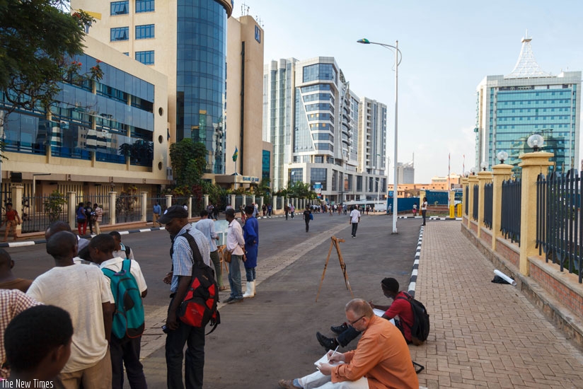 People enjoy the car-free zone introduced last year in the city centre. Some people want the City of Kigali to consult more before implementing such policies. (T. Kisambira)