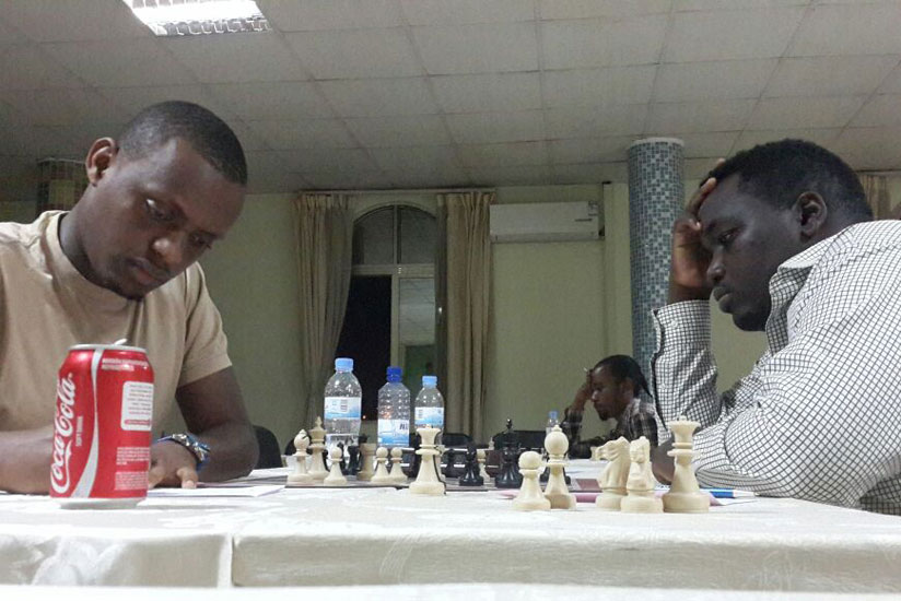 Niyibizi (left) battled for a draw in this round one encounter with CM Kabera (Photos James Karuhanga)