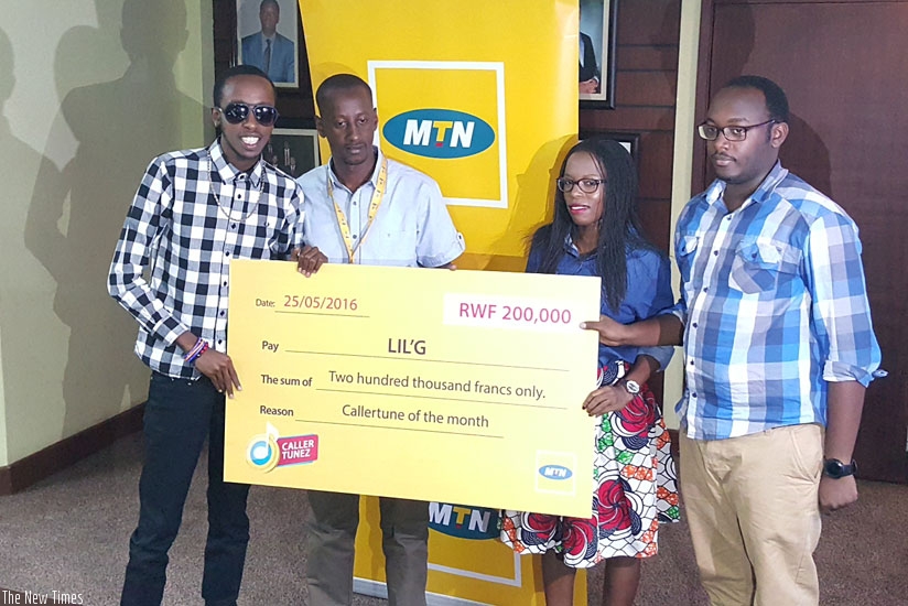 Lil-G posing with MTN team
