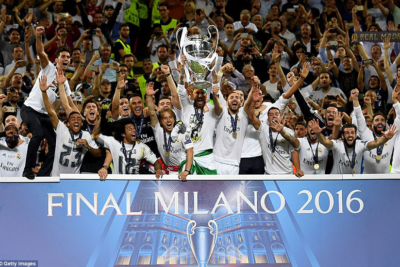 Sergio Ramos lifts the Champions League trophy after Real Madrid came out on top in the penalty shootout against Atletico Madrid. (Getty Images)