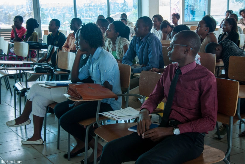 Students listen to presentations by CMA officials. Youth were urged to invest on the stock market to secure their financial future. (Teddy Kamanzi)