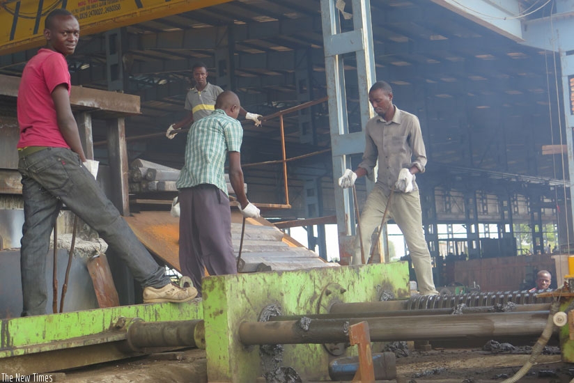 Workers at Imana Steel Ltd during the production. Aggrieved former workers laid off by the company have accused its managers of irresponsibility and exploitation, saying they are not even given protective gear such as hard hats. (Frederic Byumvuhore)
