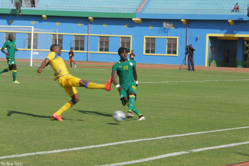 Jacques Tuyisenge tries to stop Senegalese left back Sourre Pape Ndounge during a friendly tie on Saturday. (P. Kamasa)