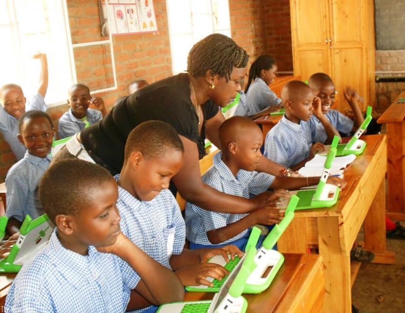 A teacher guiding pupils through a computer lesson under the One Laptop per Child programme. (File)