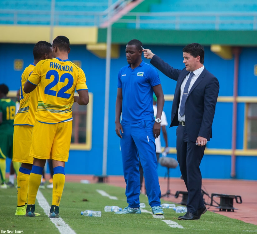 Amavubi head coach Johnathan Mckinstry gives instructions to his players during a past match. (File)