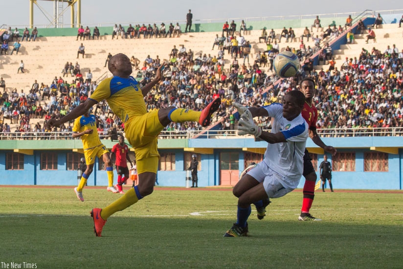 Amavubi forward Jacques Tuyisenge up against Mozambique goalkeeper Jose Ventura on Saturday. (T. Kisambira)