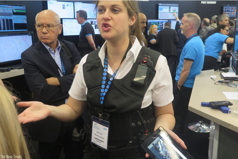 A Motorola employee models the Si series solution that boasts of body-worn radio speaker microphone and body-worn camera in one at CCW2016 conference. (Stephen Nuwagira) 