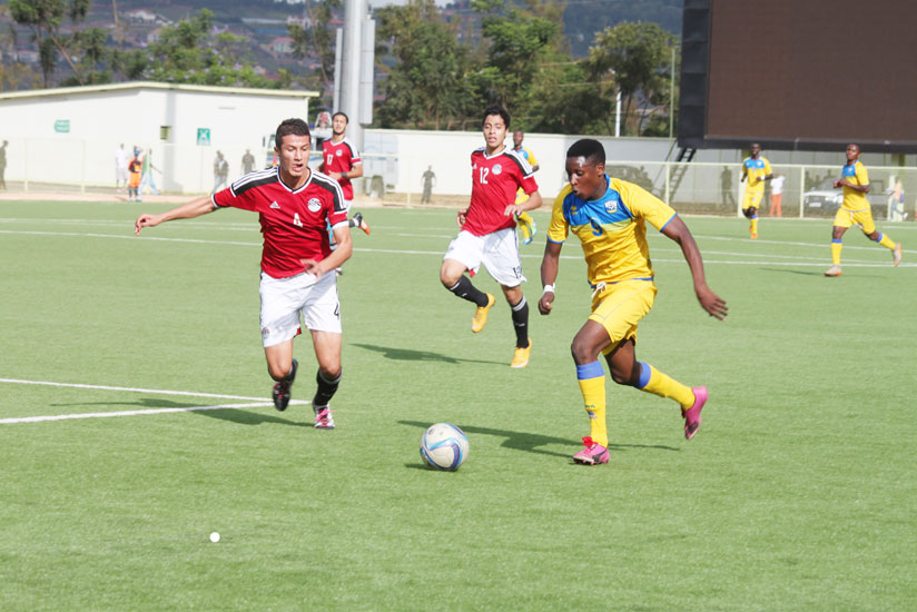Junior Wasps striker Abeddy Biramahire tries to go past an Egyptian opponent during the first leg in Kigali a fortnight ago. (Peter Kamasa)