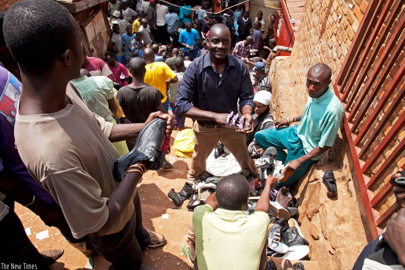 Used shoe salesmen at Kimisagara Market in Nyarugenge District. (Timothy Kisambira)