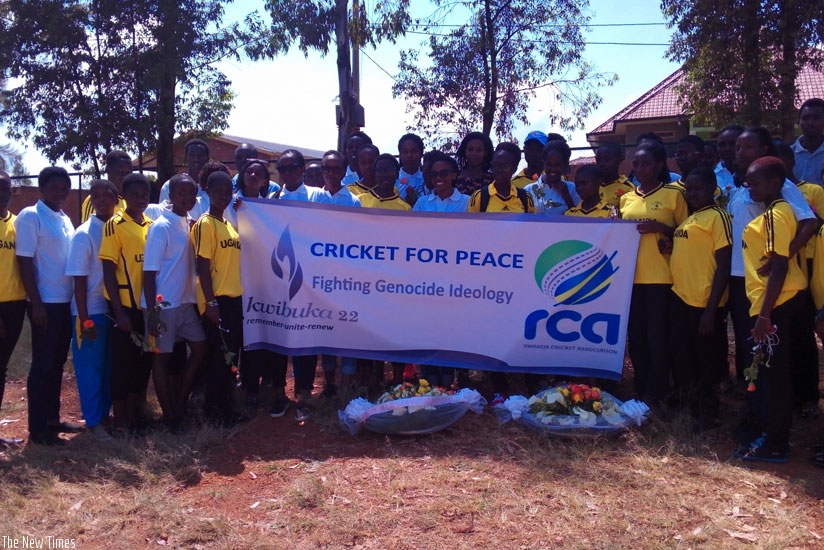 Rwanda and Uganda players and officials pose for a group photo at Nyanza Genocide Memorial Site. (Pontian Kabeera)