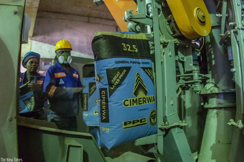Cimerwa employees monitor the plant's production line. Industries are asking for more support to enhance their production capabilities and spur exports. (File)
