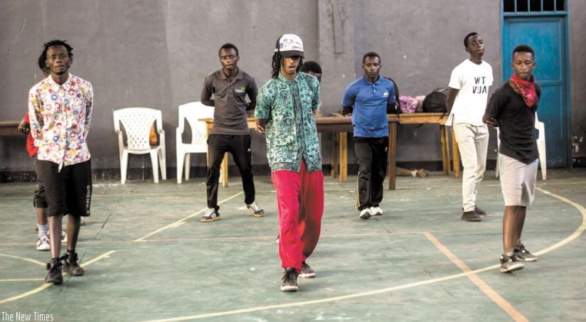 Chris Hirwa (C) takes his dance students through the drills. (Moses Opobo)