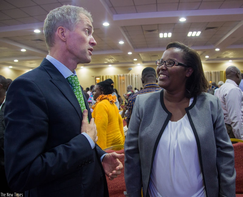 Minister Mukeshimana (R) chats with Amb. Pauwels  at the event in Kigali on Tuesday. (Faustin Niyigena)