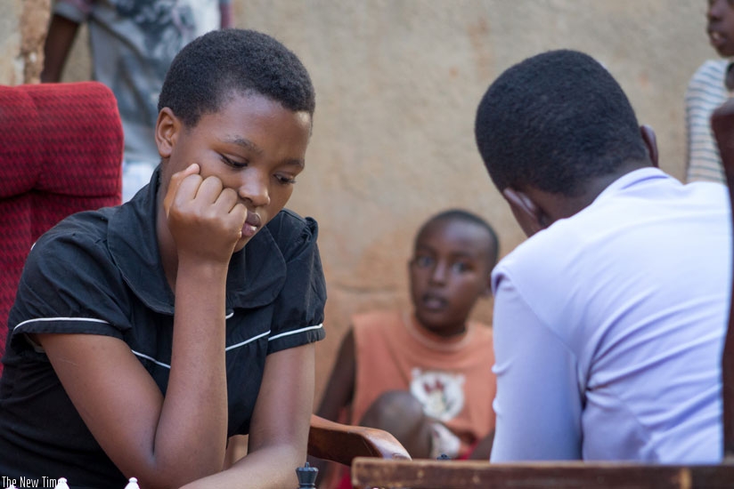 Sandrine Uwase, a P.4 pupil at Ecole Primaire Karugira in Gikondo is happy her grades improved eversince she started playing chess early last year. (J. Karuhanga)