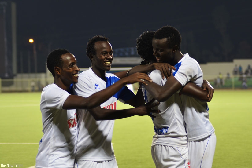 Irambona (C) is congratulated by his teammates after giving Rayon Sports the lead against Amagaju FC. Rayon won 6-0 to jump into the second place on the league table. (S. Ngendahimana)